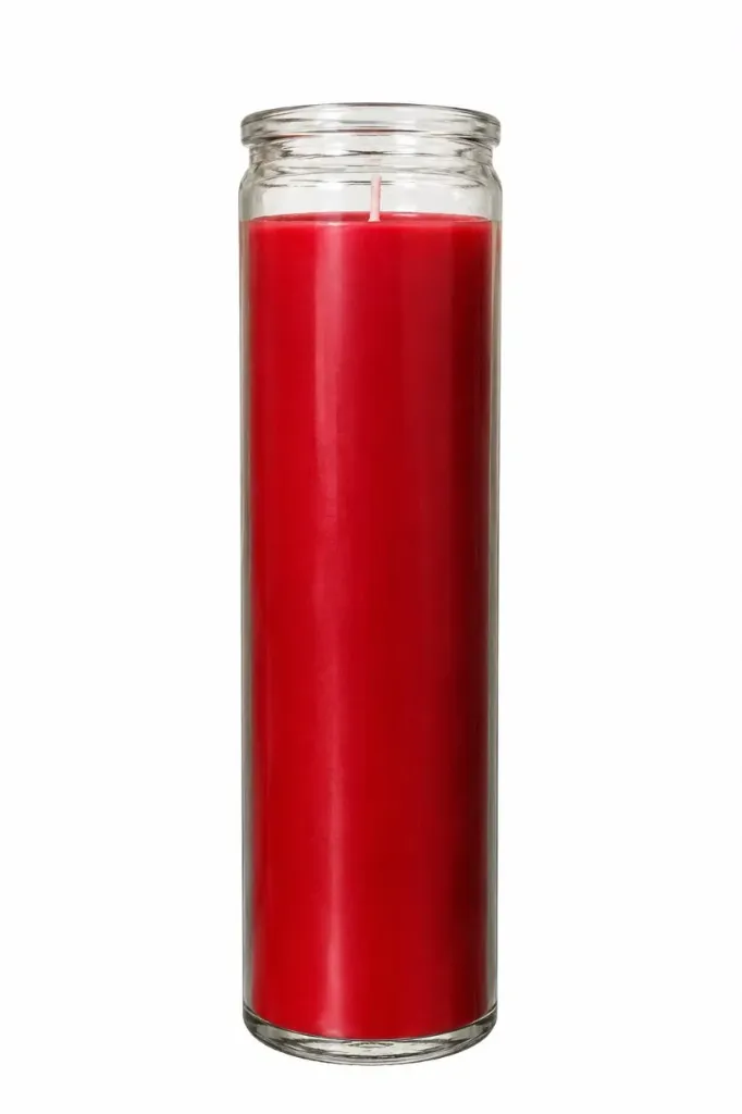 Bougie teintée dans la masse dans un verre, couleur rouge